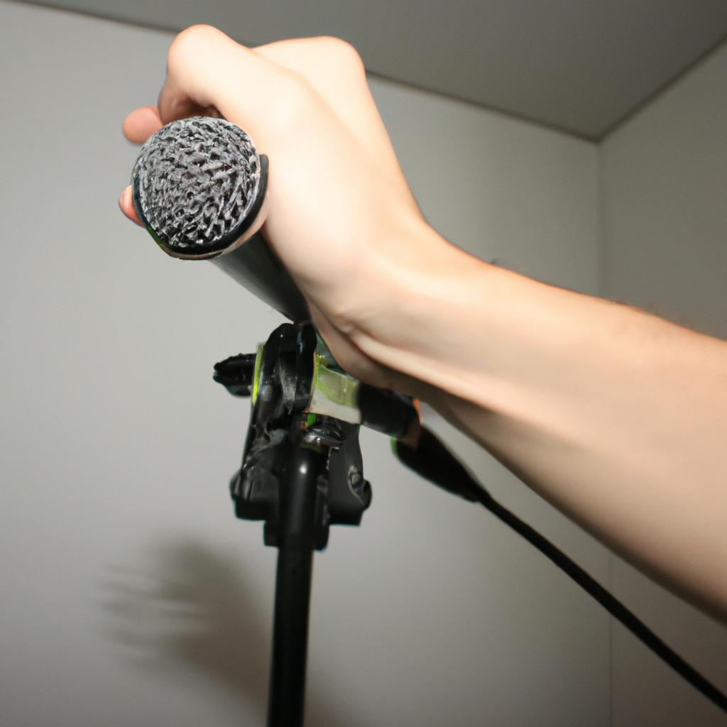 Person holding microphone, recording audio